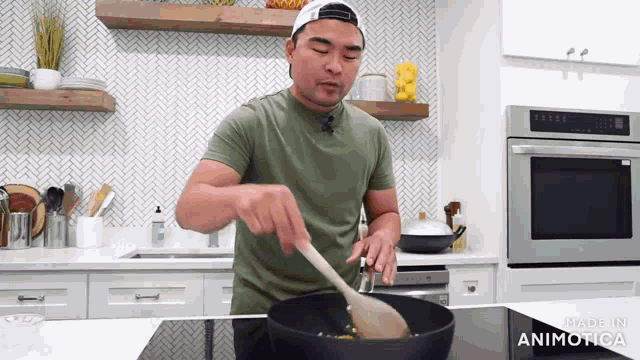 a man in a green shirt is stirring something in a frying pan with a wooden spoon in a kitchen made in animatica