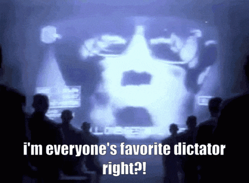 a group of people looking at a screen that says " i 'm everyone 's favorite dictator right ? "