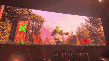 shrek is dancing in front of a large screen
