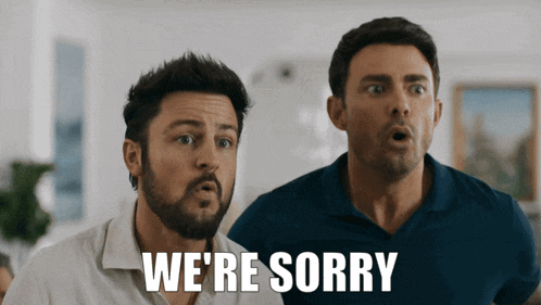 two men are standing next to each other and the words we 're sorry are on the screen