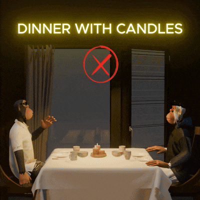 two monkeys are sitting at a table with candles and a sign that says dinner with candles