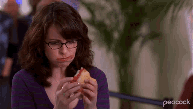 Liz Lemon wolfs down her Teamster's Sub rather than throw it away at the airport