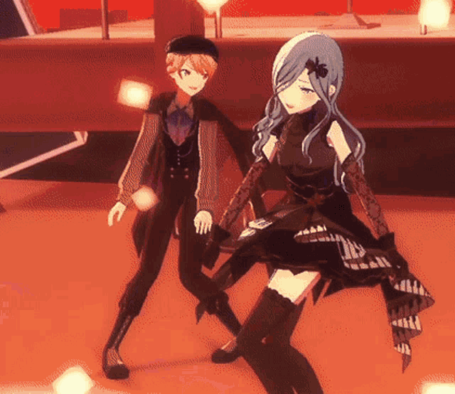a man and a woman are standing next to each other on a stage