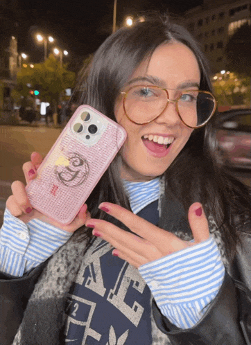 a woman wearing glasses holds a phone case that says ' i love you ' on it