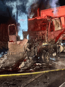 a truck that has been destroyed by a fire with smoke coming out of the windows