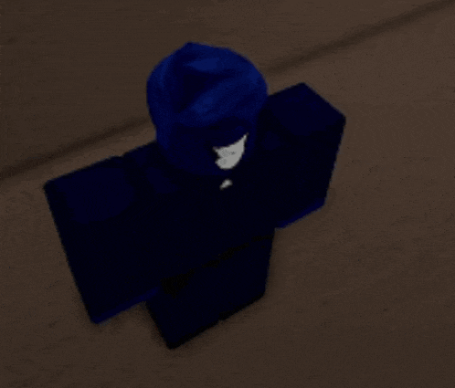 a person in a blue outfit is holding a gray pipe