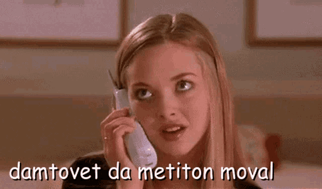 a woman is talking on a cell phone with a caption that says damtovet da metiton moval .