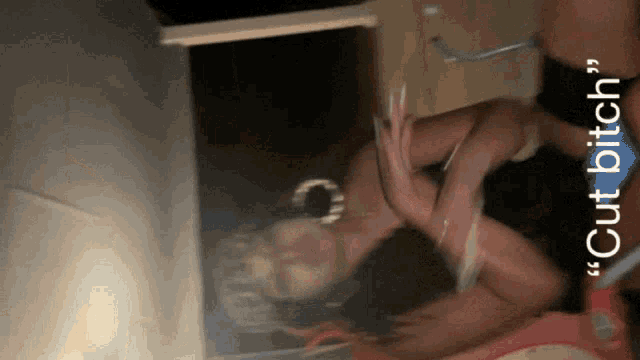a woman laying on the floor with the words " cut bitch " on the bottom right