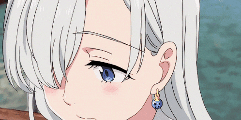 a close up of a girl 's face with a blue eye