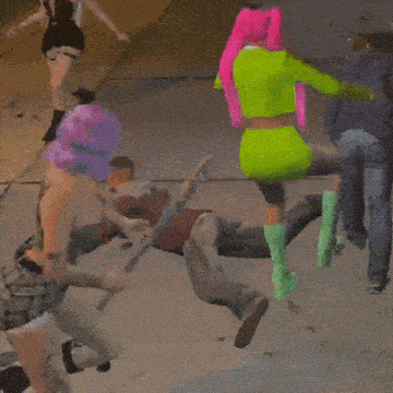 a group of people are dancing in a circle and one of them is wearing a neon green top