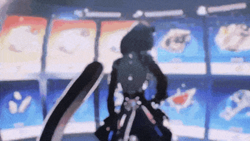 a blurry picture of a person holding a sword in front of a display of cards .