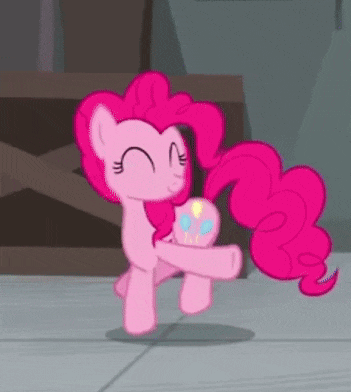 pinkie pie from my little pony equestria girls is holding a pink cupcake in her hands .