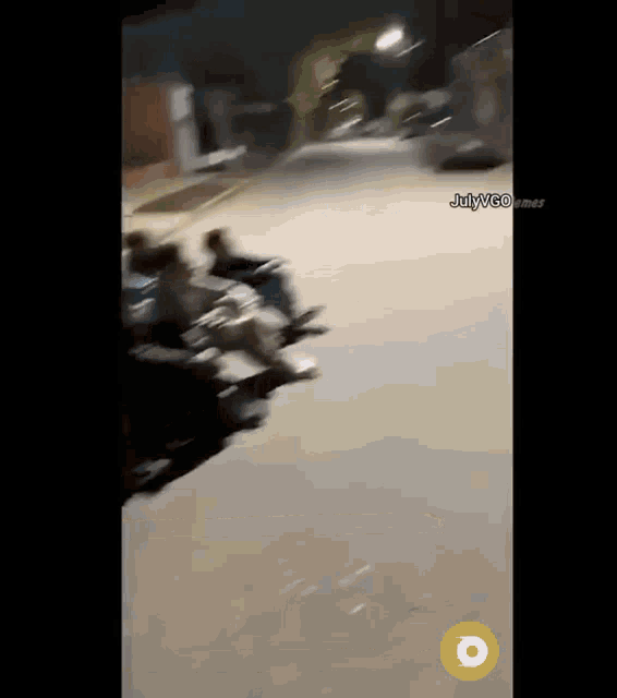 a group of people are riding motorcycles down a street with julyvgo.net at the bottom of the screen