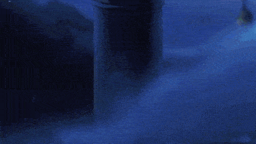 a green light is coming out of a pillar