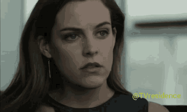 a close up of a woman 's face with the words @tvresidence visible