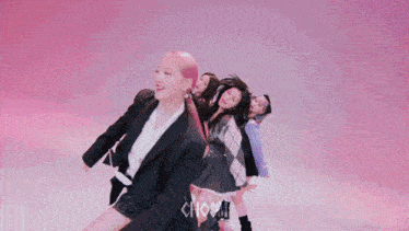 a group of girls are dancing in front of a pink background that says ' choom ' on it