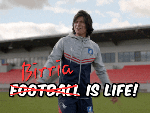 a man stands in front of a stadium with the words birtia football is life