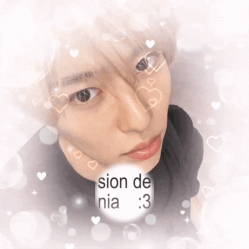 a close up of a person 's face with hearts and the words sion de nia