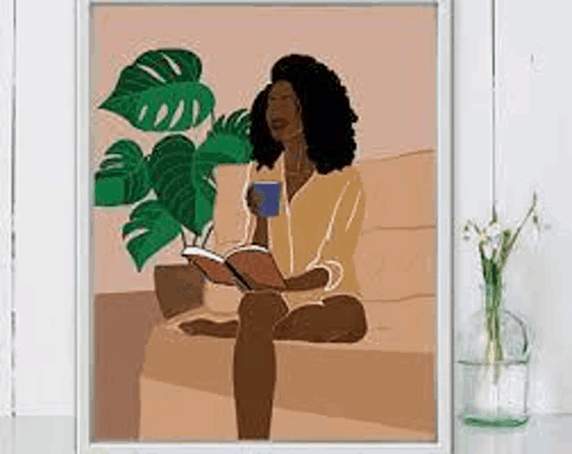 a woman is sitting on a couch reading a book while drinking coffee .