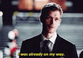 a man in a suit and tie is talking and says i was already on my way