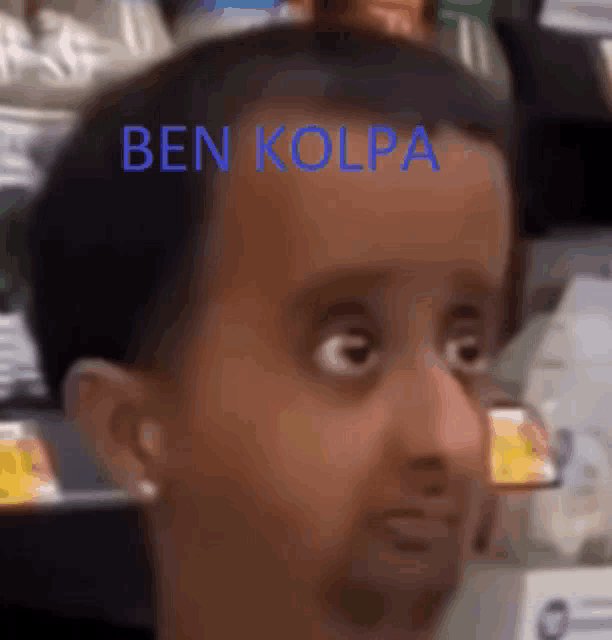 a close up of a man 's face with ben kolpa written on his forehead .