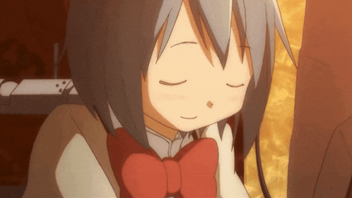 a girl with gray hair and a red bow tie is sleeping with her eyes closed