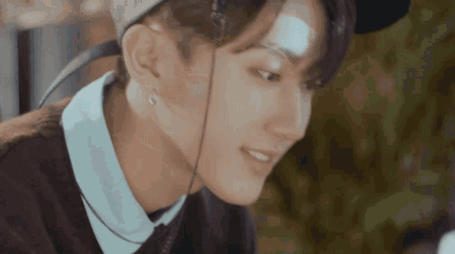 a close up of a person with a bandage on their face