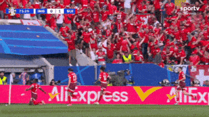 a soccer game is being played in front of a banner for all express
