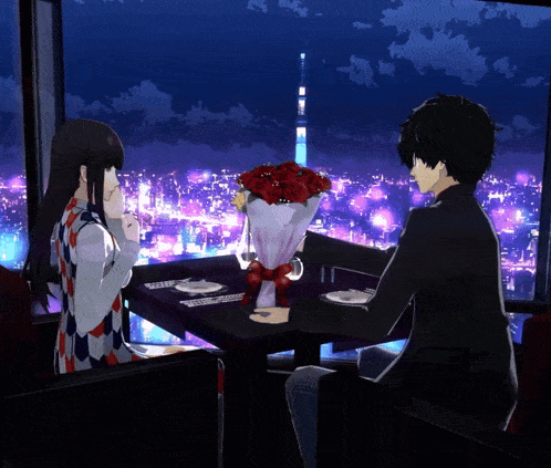 a man and a woman are sitting at a table with a bouquet of red roses