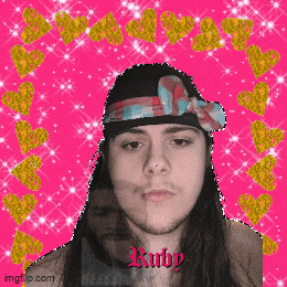 a man with long hair wearing a bandana with the name ruby on it