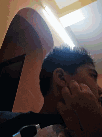 a close up of a person 's ear with a light shining on it
