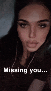 a close up of a woman 's face with the words missing you