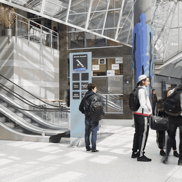 a group of people standing around a sign that says security account