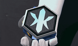 a person is holding a cube with a blue star on it