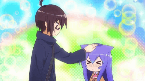 a boy is petting a girl 's head with a cat ear