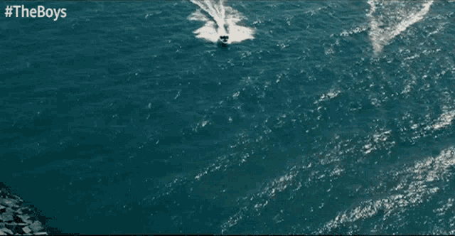 an aerial view of a jet ski in the ocean with #theboys written above it