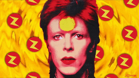 a close up of david bowie 's face with a yellow circle in the middle of his forehead