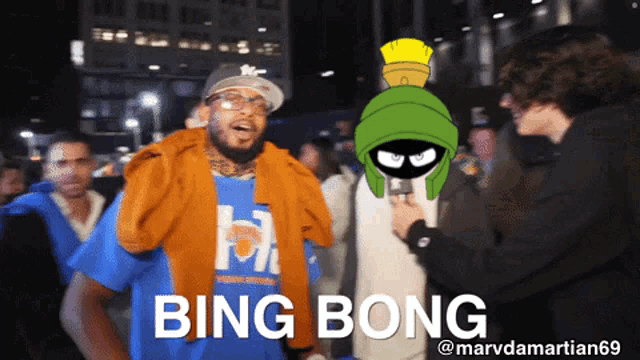 a man with a blue shirt that says " bing bong "