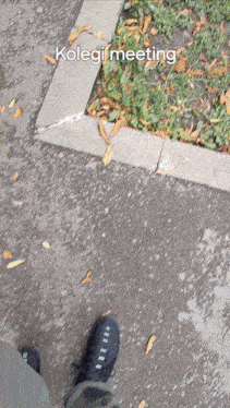 a picture of a person 's feet on a sidewalk with the words koleji meeting written above them