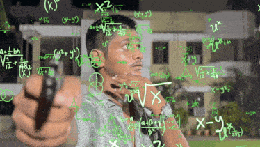 a man stands in front of a board with mathematical equations written on it
