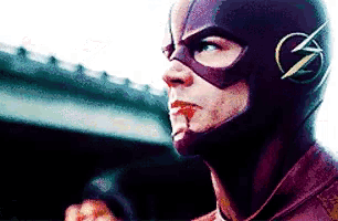 a close up of a person wearing a flash helmet