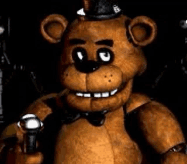 a teddy bear is holding a flashlight in his hand .