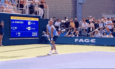 a tennis match is being played in front of a large screen that says fage