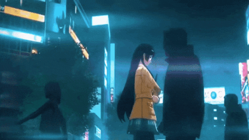 a woman in a yellow jacket stands next to a man
