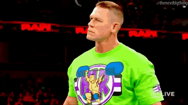 a man wearing a green shirt that says wwe