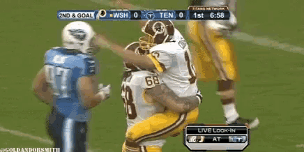 a football game is being played between the redskins and the titans