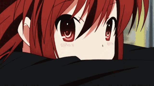 a close up of a red haired anime girl 's eyes