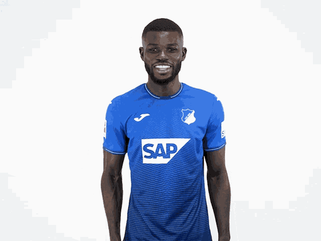 a man wearing a blue shirt with sap on it