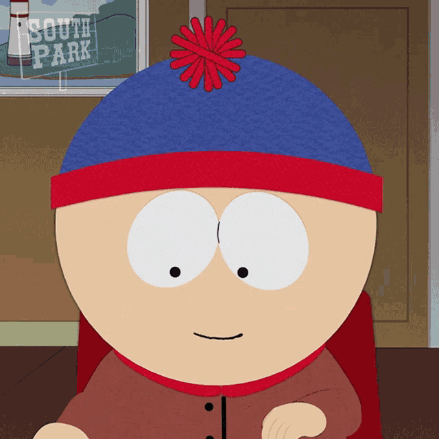 stanley from south park is wearing a blue hat with a red flower on top