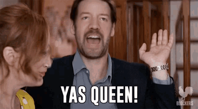 a man and a woman are standing next to each other and the man is saying yas queen